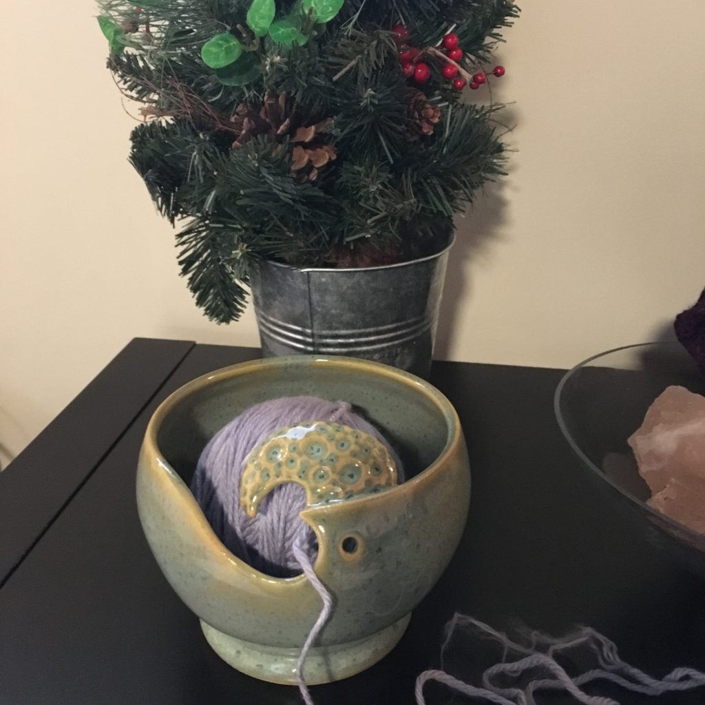 A hand wound ball of yarn in my custom yarn bowl.