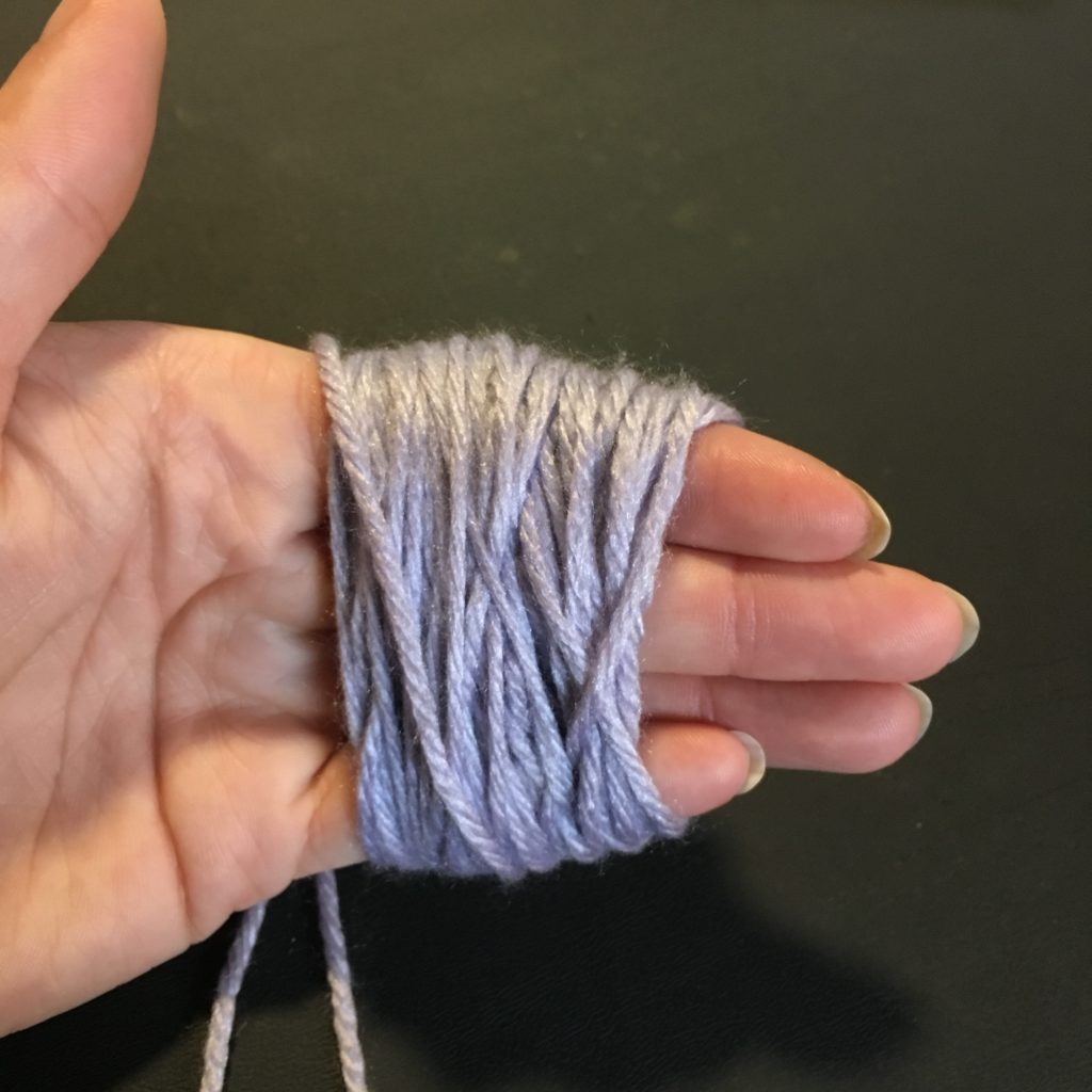Step two fro hand winding a ball of yarn