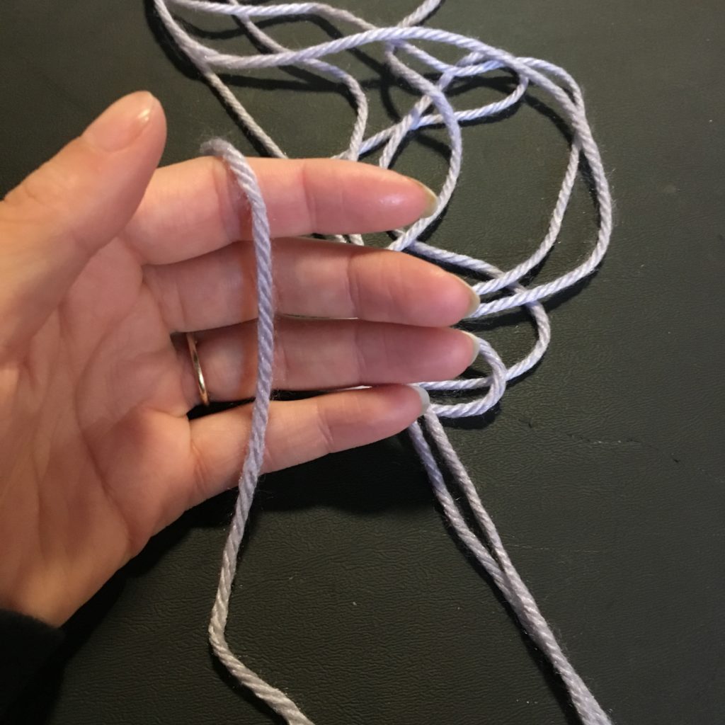 How to start winding a ball of yarn by hand