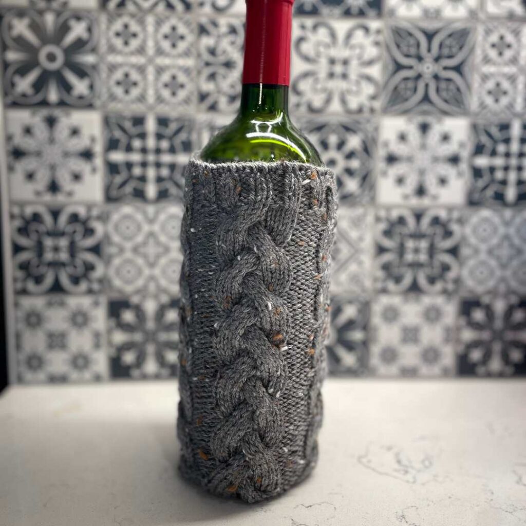 Braided Wine Bottle Sweater Knitting Pattern from Knitting in the Park. Knit the perfect hostess gift.