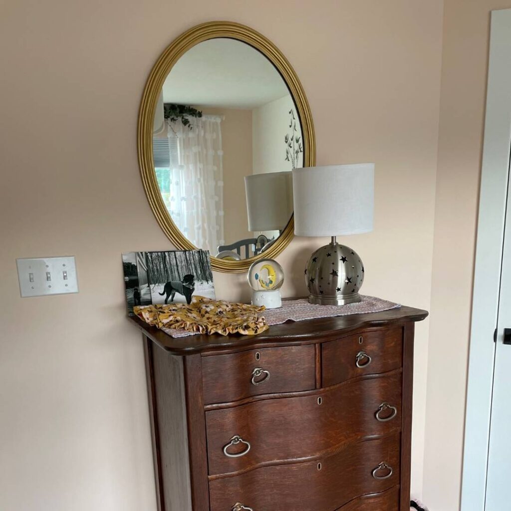 Painted gold mirror in our baby girl's woodland themed nursery