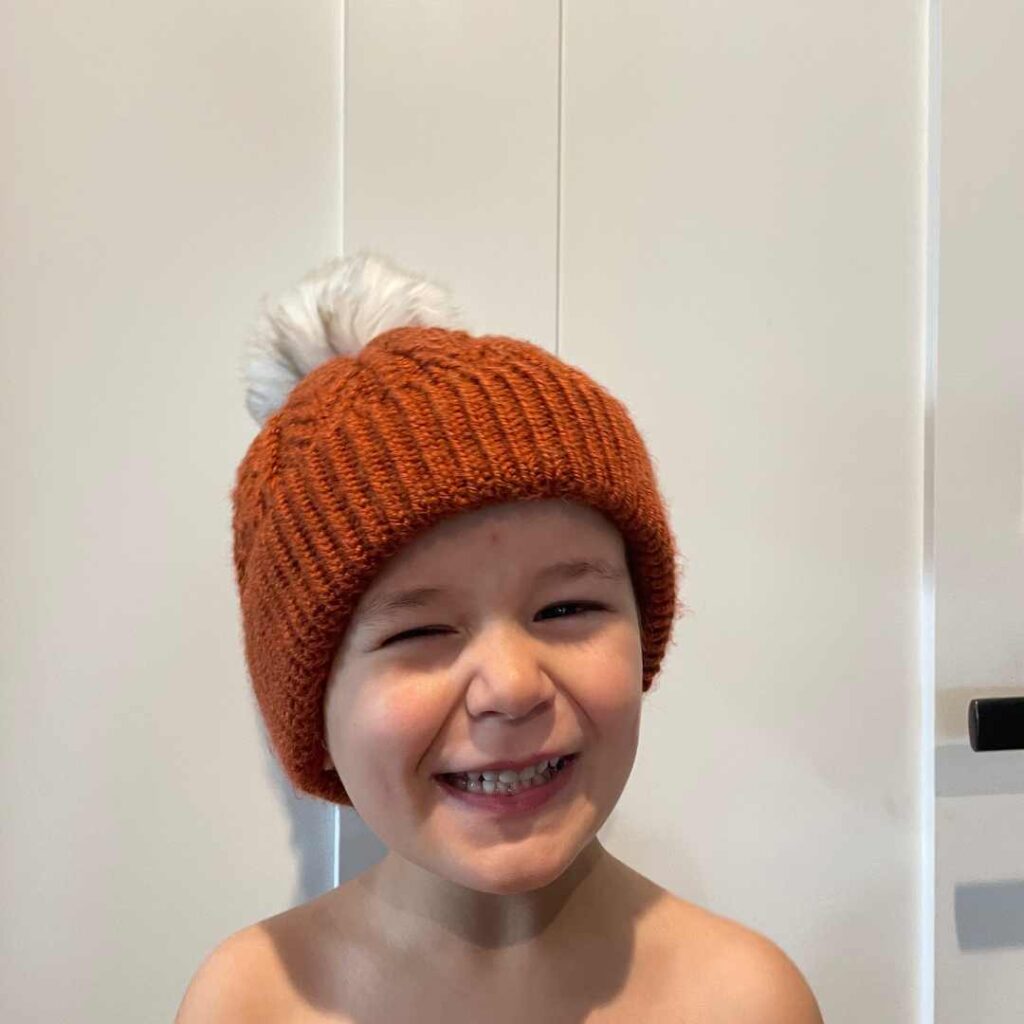 My son wearing his Bjorn's Hat - he's 1/2 the inspiration for this knitting pattern.