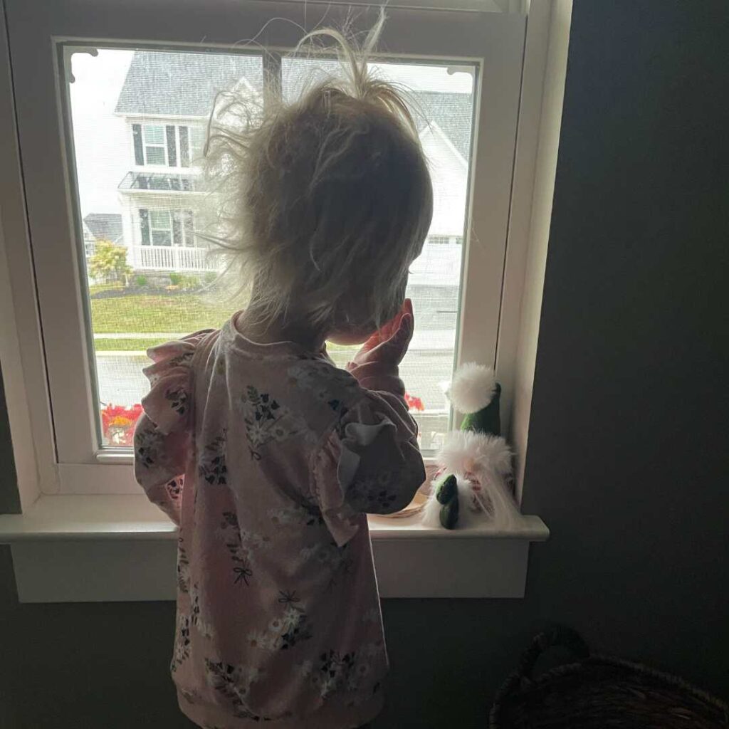My two year old blowing kisses to her Aldi Christmas Gnome. See how we used the Magic of Christmas to put up Christmas Tree in September