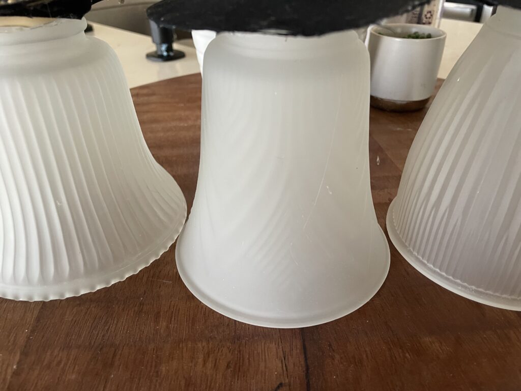 You'll need a sconce some paper, and a few embellishments to make the viral Ghost Sconce
