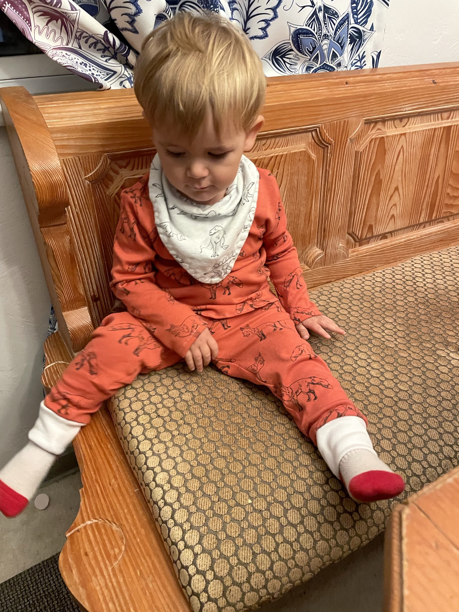 Fynn sitting at the table before refinishing a German Dining table.