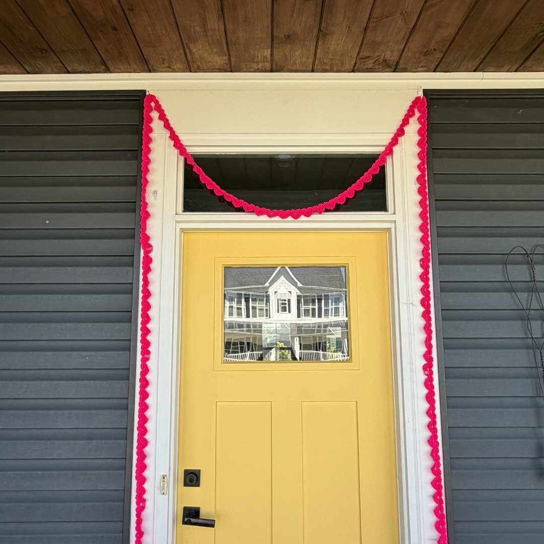 Crochet a String of Hearts Garland to add a pop to your front porch