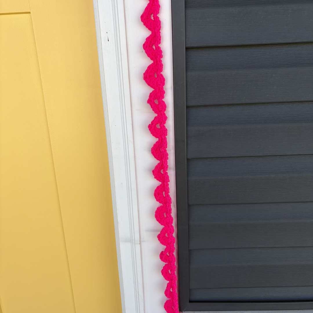 Add a little bit of love to your home's exterior and crochet a String of Hearts Garland